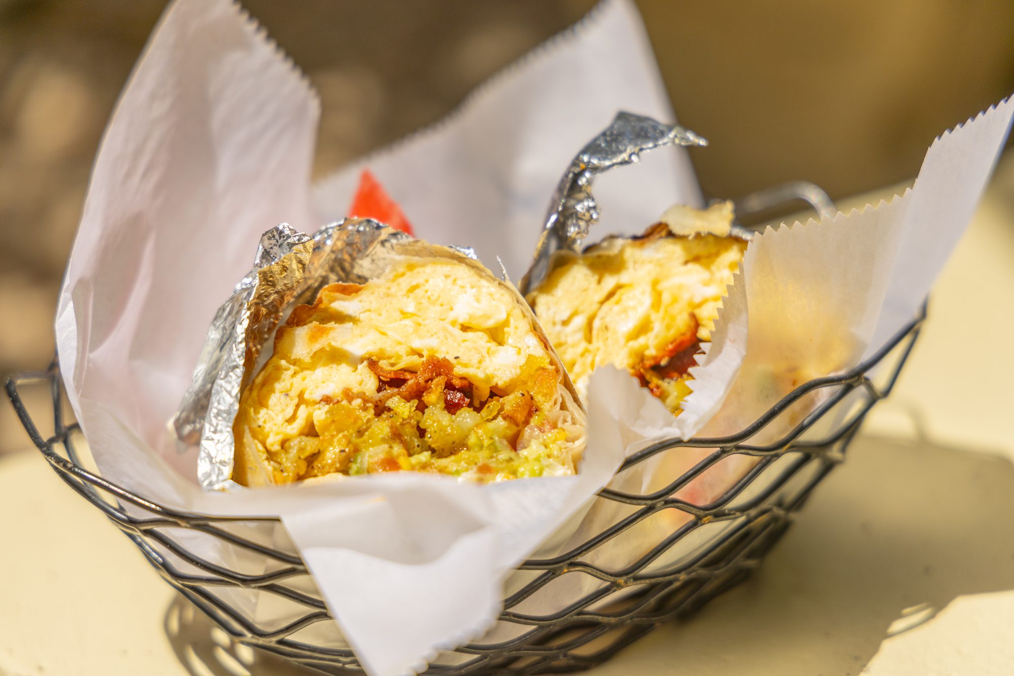 A breakfast burrito in a basket