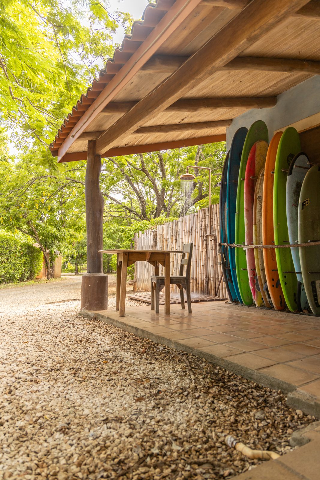 Board racks and outdoor shower at a surf station